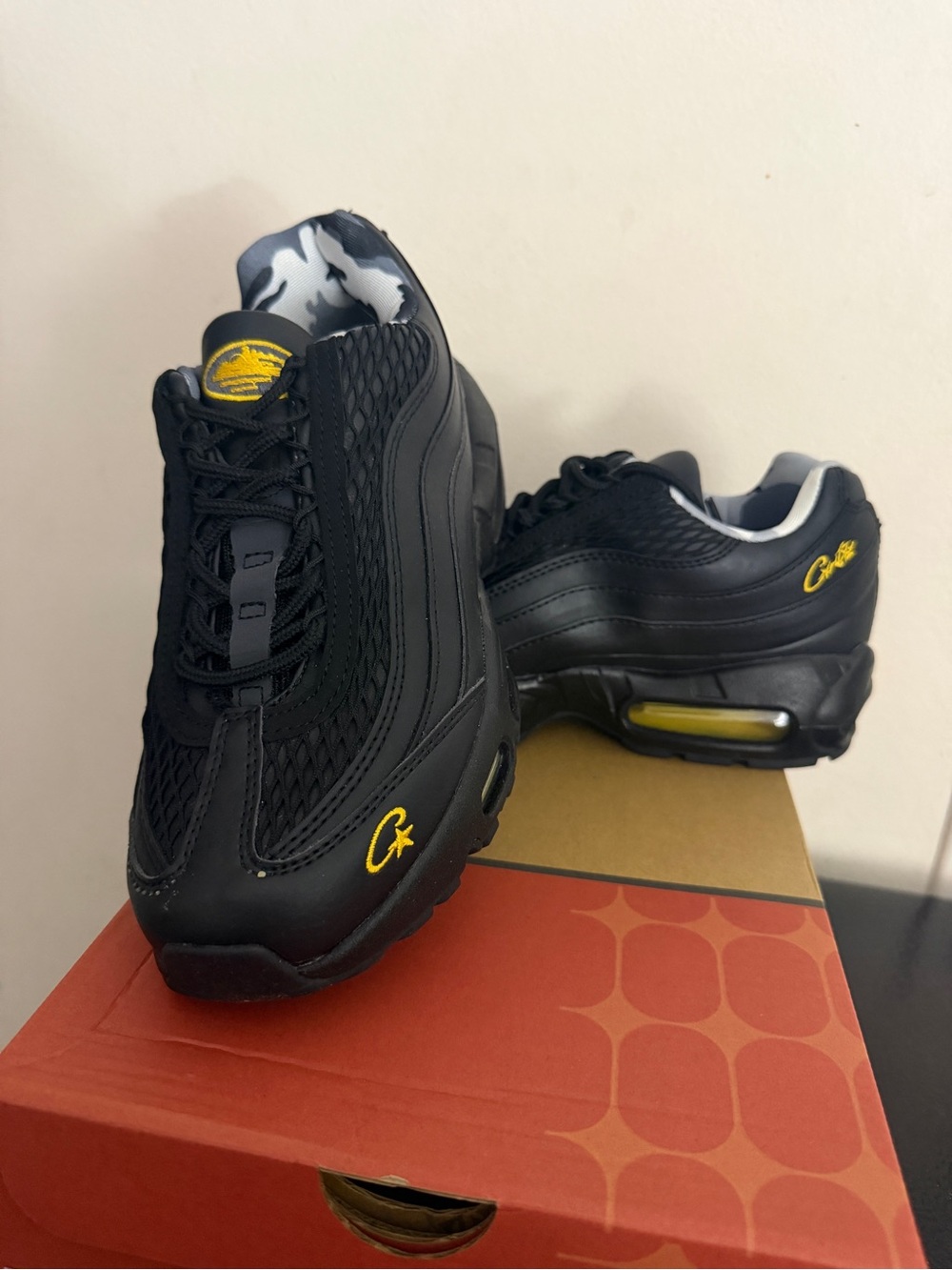 Nike Men's Black Sneakers with Yellow Accents